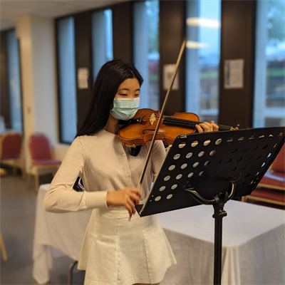 Qiqi Zhang plays the violin at Victoria Hospital Foundation's art class